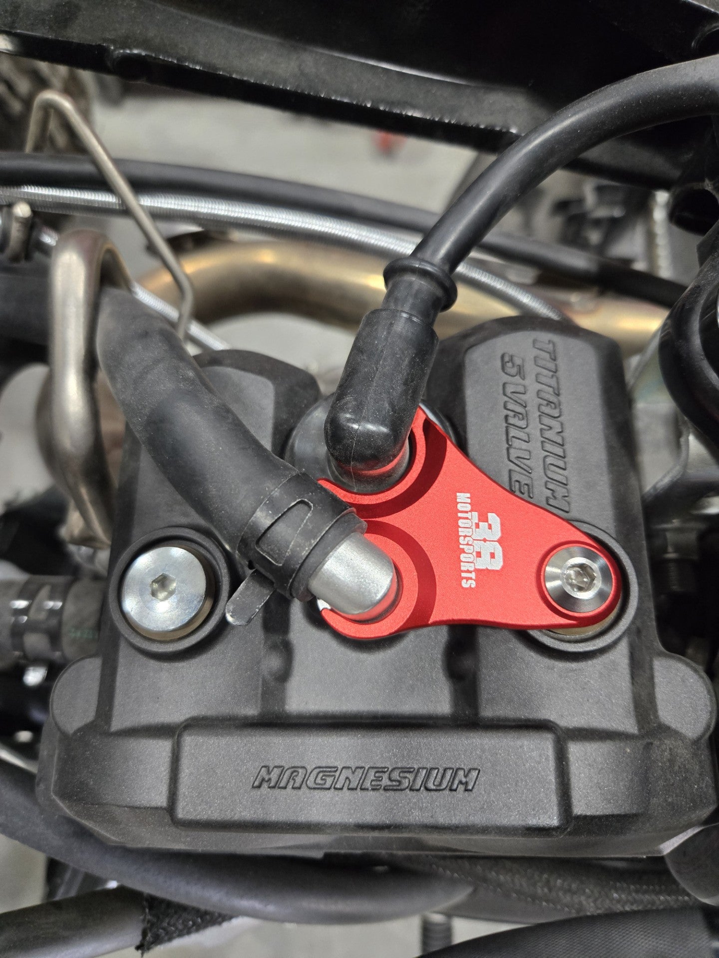 Spark Plug Oil Vent Line Hold Down