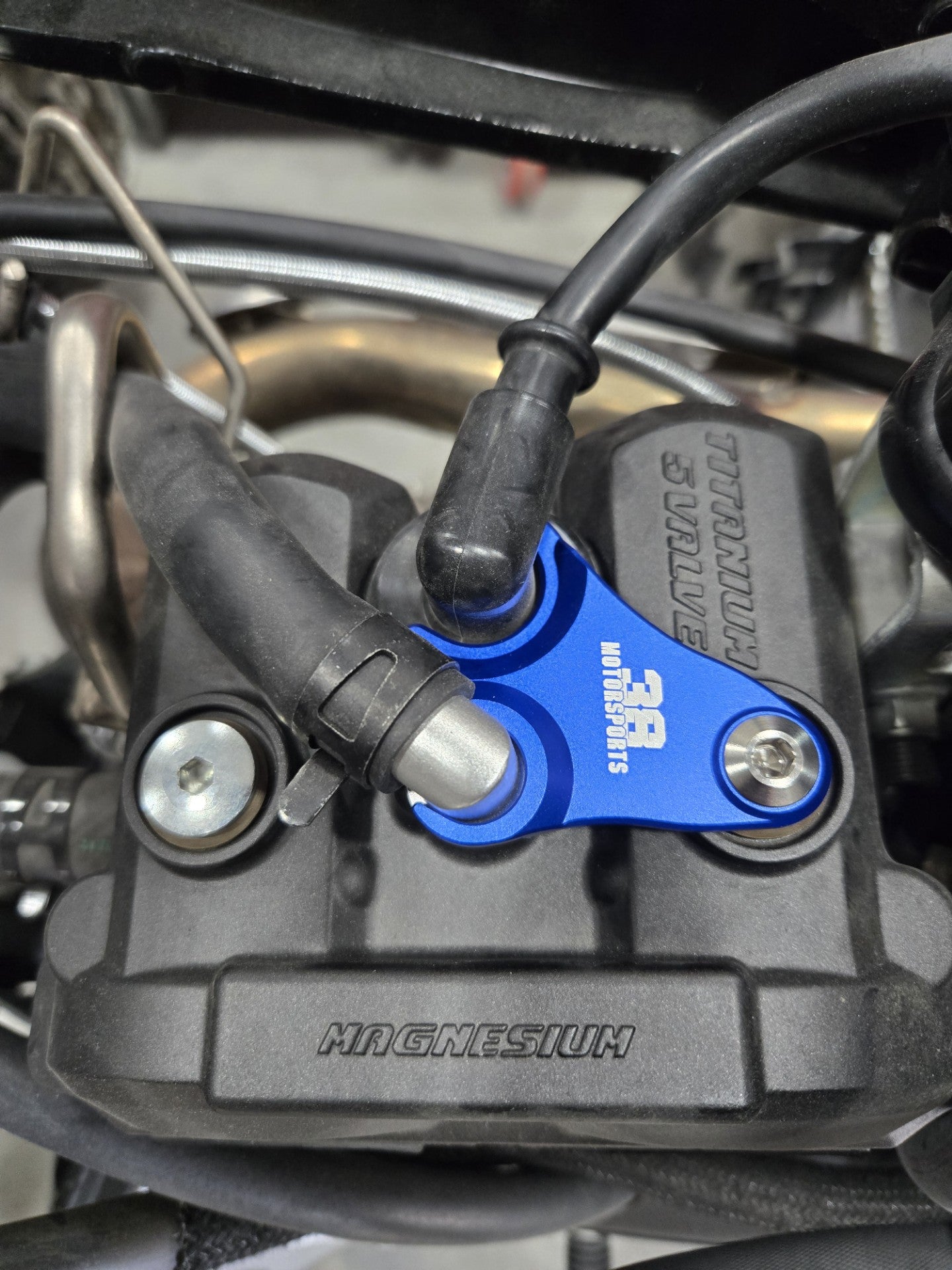 Spark Plug Oil Vent Line Hold Down
